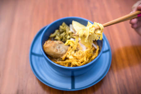 Thai food, Khao Soi Kai, yellow noodle with coconut curry soup and chicken