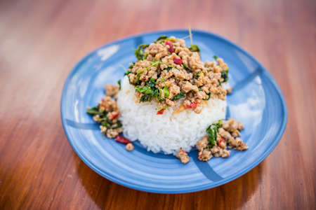 Thai food, Khao Kaprao Hmoo, pork fried with sweet brasil cover the steam riceの写真素材