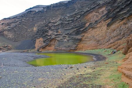 Scenic view of Green Lagoon in volcanic landscapeの写真素材