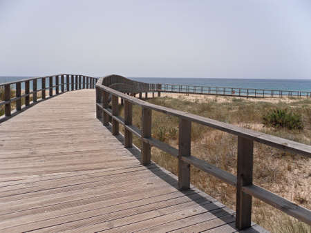 Wooden walkway overlooking the Ria de Alvor, Algarveの写真素材