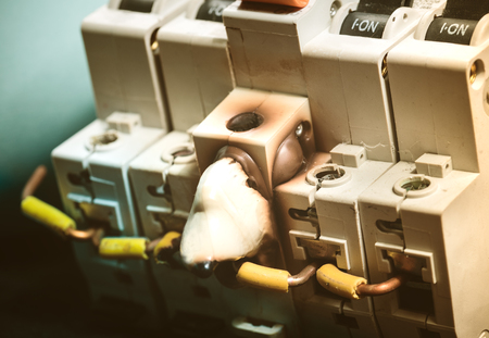 Burn and Melting Switch Fuse Disconnector with On Position. Concept of Overload Electrical Current and Electricity, Power, Fuse Ratingの写真素材
