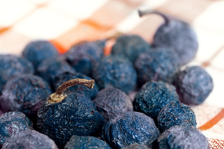 Dried blueberry fruit lying on the napkin. High detailed close up with selective focusの写真素材