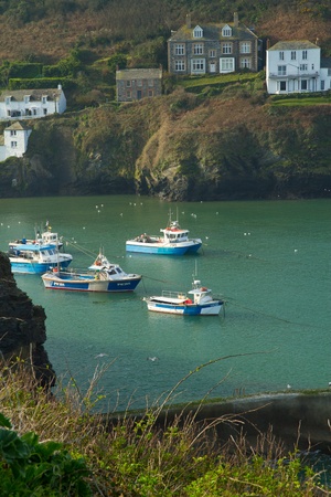 Boats sheltering in the harbour at Port Isaac fishing village in Cornwall