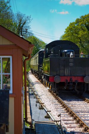 A steam train at Staverton Steam Railway Station in Devonのeditorial素材