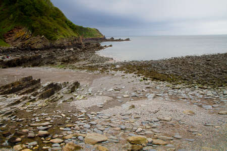 The shingle beach at Woody Bay near Lynton and Lynmouth in Devonの写真素材