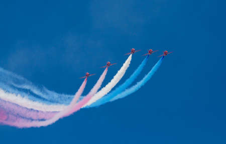 WESTON-SUPER-MARE, SOMERSET-JULY 23RD 2012   The Red Arrows at the Grand Pier Air Show in Weston-super-Mare on Monday 23rd July 2012   A brilliant performance against a beautiful blue skyのeditorial素材
