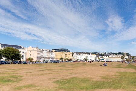 Seafront lawns Teignmouth Devon England with blue skyのeditorial素材