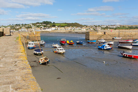 Boats in St Michaels Mount Harbour Cornwall England at low tideのeditorial素材