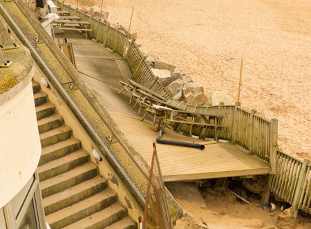 FISTRAL BEACH NEWQUAY CORNWALL-MARCH 14TH 2014   The damage caused to the café and retail units on Fistral beach by the storms of 3rd January 2014 remains unrepaired with the Easter tourist season rapidly approachingのeditorial素材