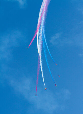 RAF Royal Airforce Air Force aerobatic team The Red Arrows with smoke trails red white and blue