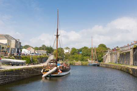 Tall ship Charlestown harbour near St Austell Cornwall England UK in summer with blue sky and sea with touristsのeditorial素材