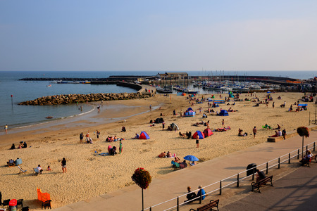 Lyme Regis seafront Dorset England UK in Lyme Bay on the Jurassic Coast the famous harbour wall,The Cobb, features in the French Lieutenantのeditorial素材