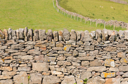 Dry stone wall traditional construction The Gower Peninsula South Wales UK with no mortarの写真素材