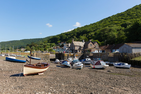 Porlock Weir Somerset England UK near Exmoor Heritage with boats at low tide in summerの写真素材