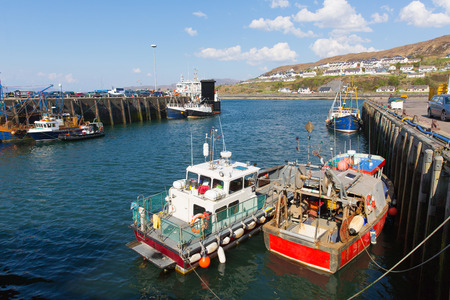 Fishing boats Mallaig port Scottish Highlands Lochaber Scotland UK on the west coast near Isle of Skye in summer with blue skyのeditorial素材