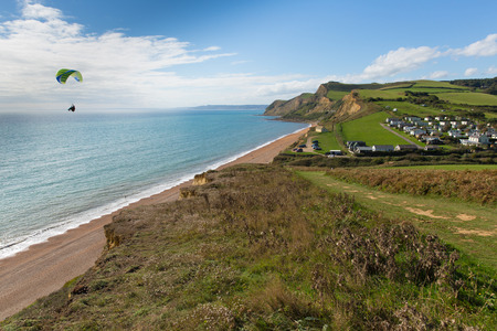Hang glider flying at Eype west Dorset England uk small coast village south Bridport and near West Bayの写真素材