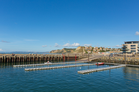 WEST BAY, DORSET, UK-SEPTEMBER 23rd 2016:  Fine calm late summer weather was enjoyed by visitors to West Bay harbour, Dorset, England, UK on Friday 23rd September 2016のeditorial素材