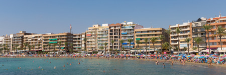 Torrevieja Spain busy and crowded Spanish beach with people enjoying the winter sunのeditorial素材