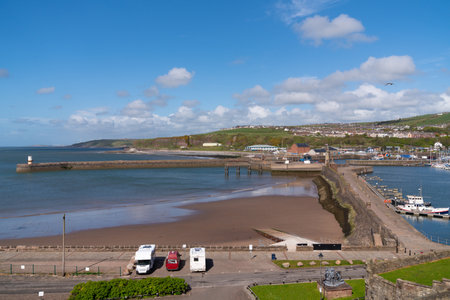 Whitehaven Cumbria England UK harbour walls with motorhomes and campervan parked near the Lake Districtの写真素材