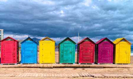 Beach huts in Spain bright colours with red green blue yellow purple colours