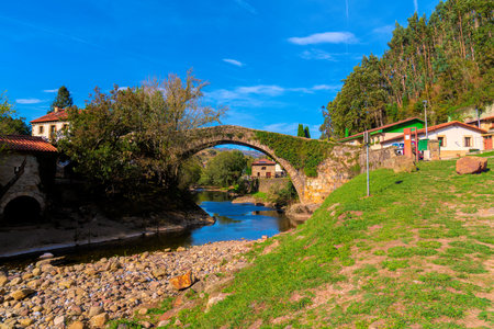 Old roman bridge Lierganes Cantabria Spain over River Miera in pretty village located 15 miles from...