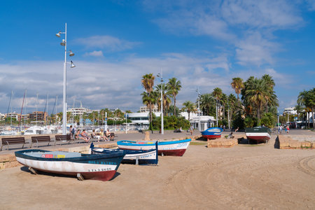 Seafront view of boats in The Wharf and Breakwater area in the sunshine, Salou Costa Dorada Catalonia Spainのeditorial素材