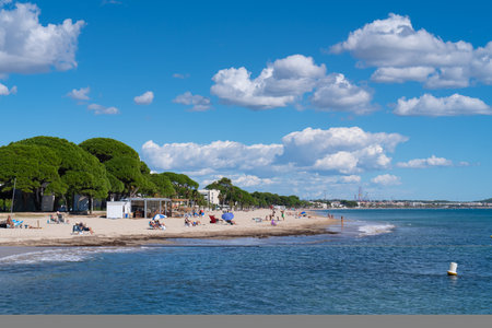 Cambrils Esquirol beach with visitors enjoying the sunshineのeditorial素材