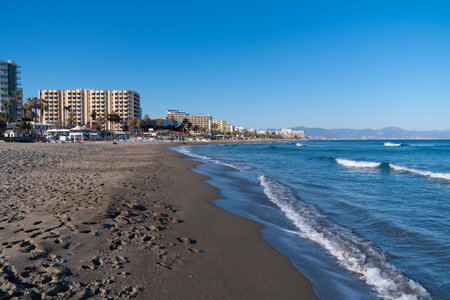 Benalmadena beach view towards Carihuela and Torremolinas with beautiful blue sky and sea Benalmadena, Spain on Thursday 2nd March 2023のeditorial素材