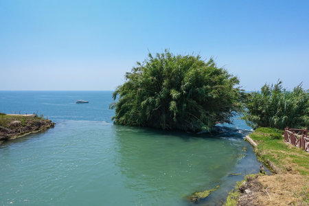 View from the top of Duden waterfalls tourist attraction Antalya Turkey on Mediterranean coast with blue sea and skyの写真素材