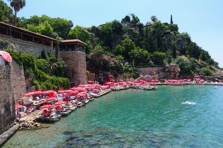 Kaleici beach with tourists built on a raised platform in the old town marina Antalya, Turkey on Tuesday 20th June 2023のeditorial素材