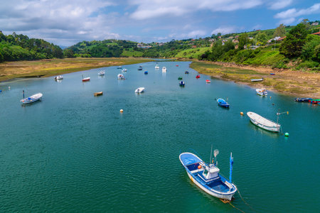 Boats on San Vicente de la Barquera Brazo Mayor river Cantabria Spainの写真素材