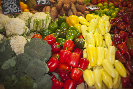 Vegetables and fruits in row at a farmers marketの写真素材