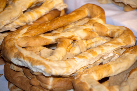 Group of salted pretzels on market stall