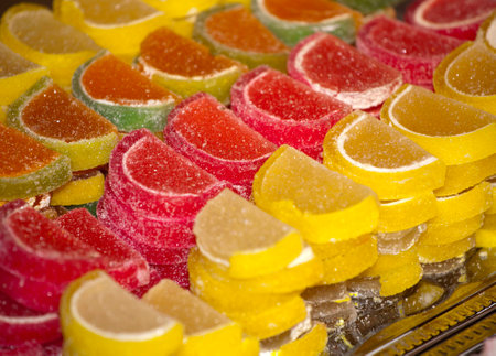 Background of colorful fruity candies and jelly close upの写真素材