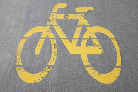 Bicycle way symbol on city street as a backgroundの写真素材