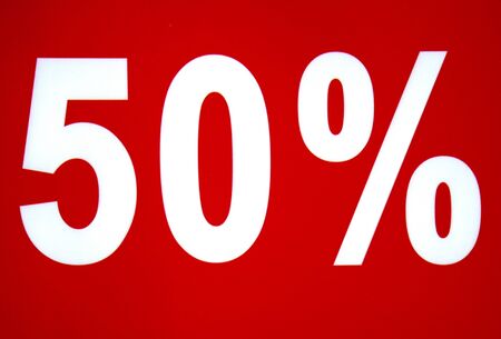 Discount 50 sign on red background with white letters. 50 percent icon sale signの写真素材