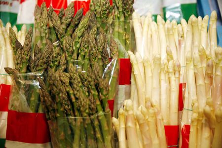 Group of white and green  asparagus as a backgroundの写真素材