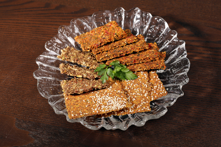 Healthy bread crackers from grain seeds sesame spices healthy food. Broken pieces grain bread crackers seedsの写真素材