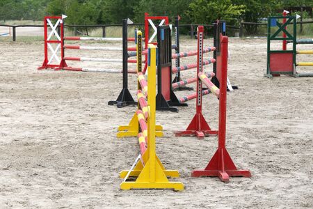 Old retro wooden barriers on the ground for jumping horses and ridersの写真素材