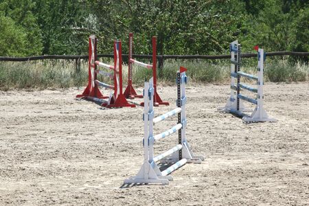 Colorful wooden barriers on the ground for jumping horses and ridersの写真素材