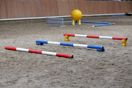 Empty field for equitation trainings or competition in empty riding hallの写真素材