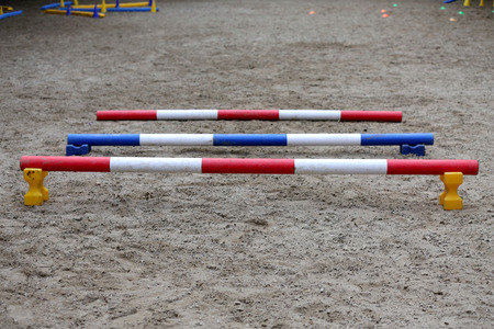 Empty field for equitation trainings or competition in empty riding hallの写真素材