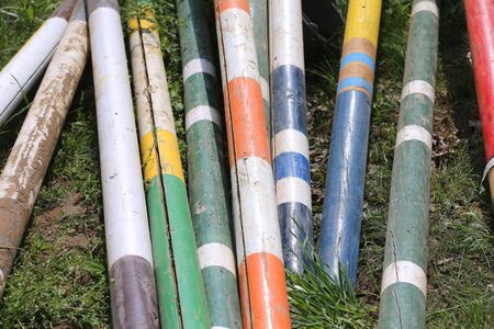 Image of show jumping poles on the training field. Wooden barriers for jumping horses as a...