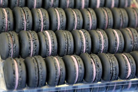 Colorful macarons background close up. Different colorful macaroons background. Shallow depth of fieldの写真素材