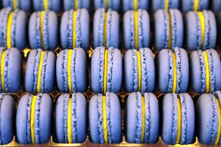 Colorful macarons background close up. Different colorful macaroons background. Shallow depth of fieldの写真素材