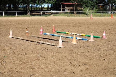 Accessories for horse trainings and events in rural equestrian training center. Image of an empty...