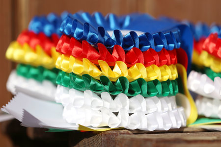 Pile of horse sport trophies rosettes at equestrian event at summertime outdoorsの写真素材