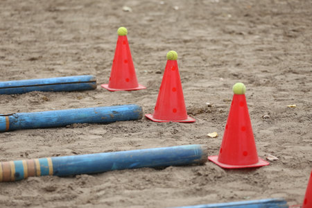 Obstacles and buoys in the sand in an empty equestrian center