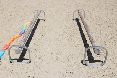 Show jumping poles obstacles, barriers, waiting for riders on show jumping training. Horse obstacle...