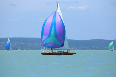Lake of Balaton, Hungary Europe. 06 July 2023: Sailboat sail in windy weather in the turquoise...